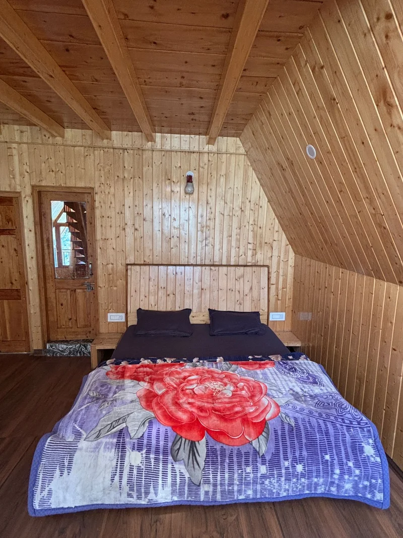 Emberwood Cottage Interior — Warm Wood and Mountain Views