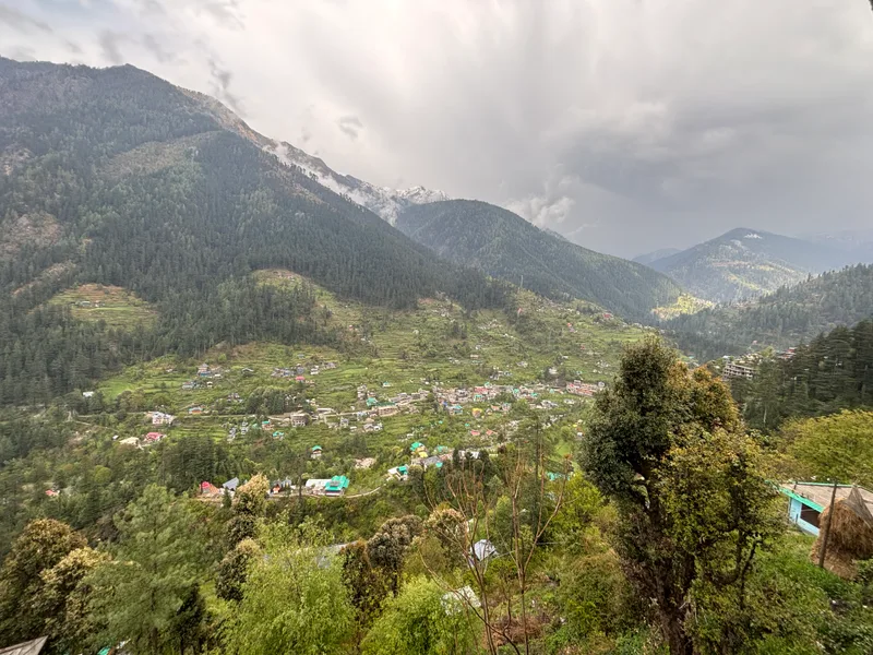 Mountains and clouds visible from the café in Jibhi